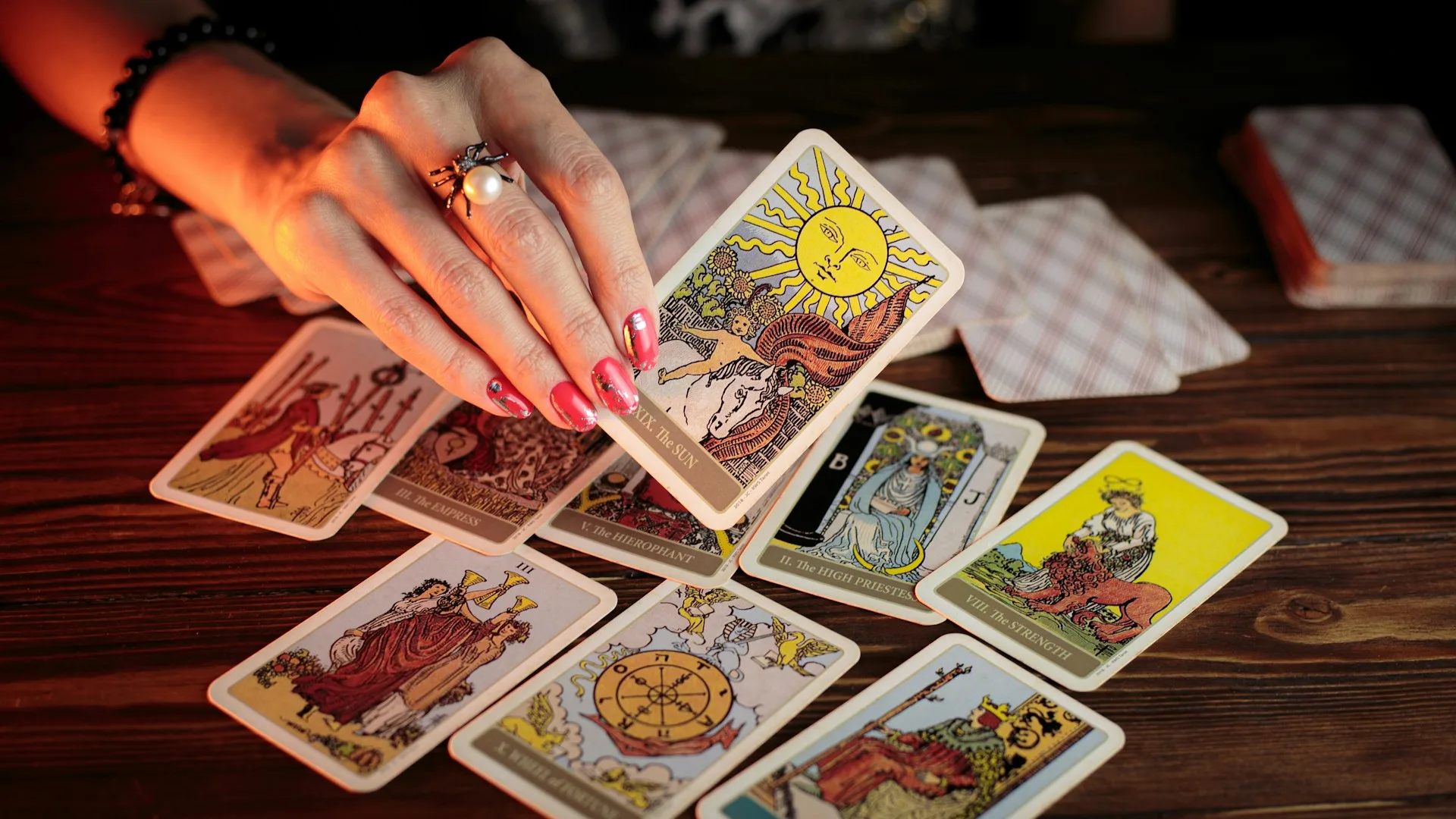 A tarot reader doing prophecy through divination - Photo by petr sidorov on Unsplash